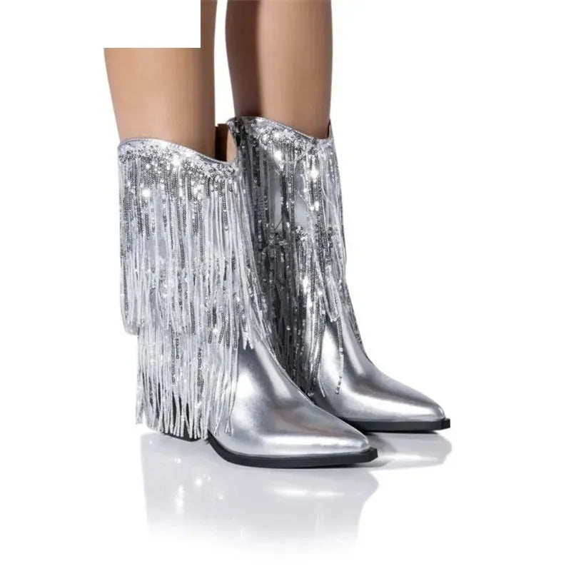 Women's black chunky heel tassel boots with a high stiletto heel and pointed toe.