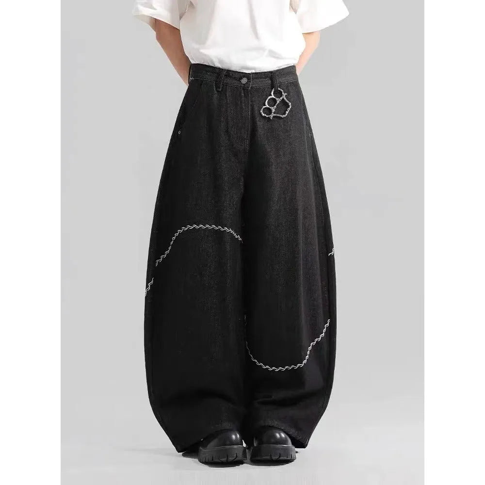 Black straight-leg jeans with micro-elastic polyester denim fabric showing zip fly and mid-rise waist