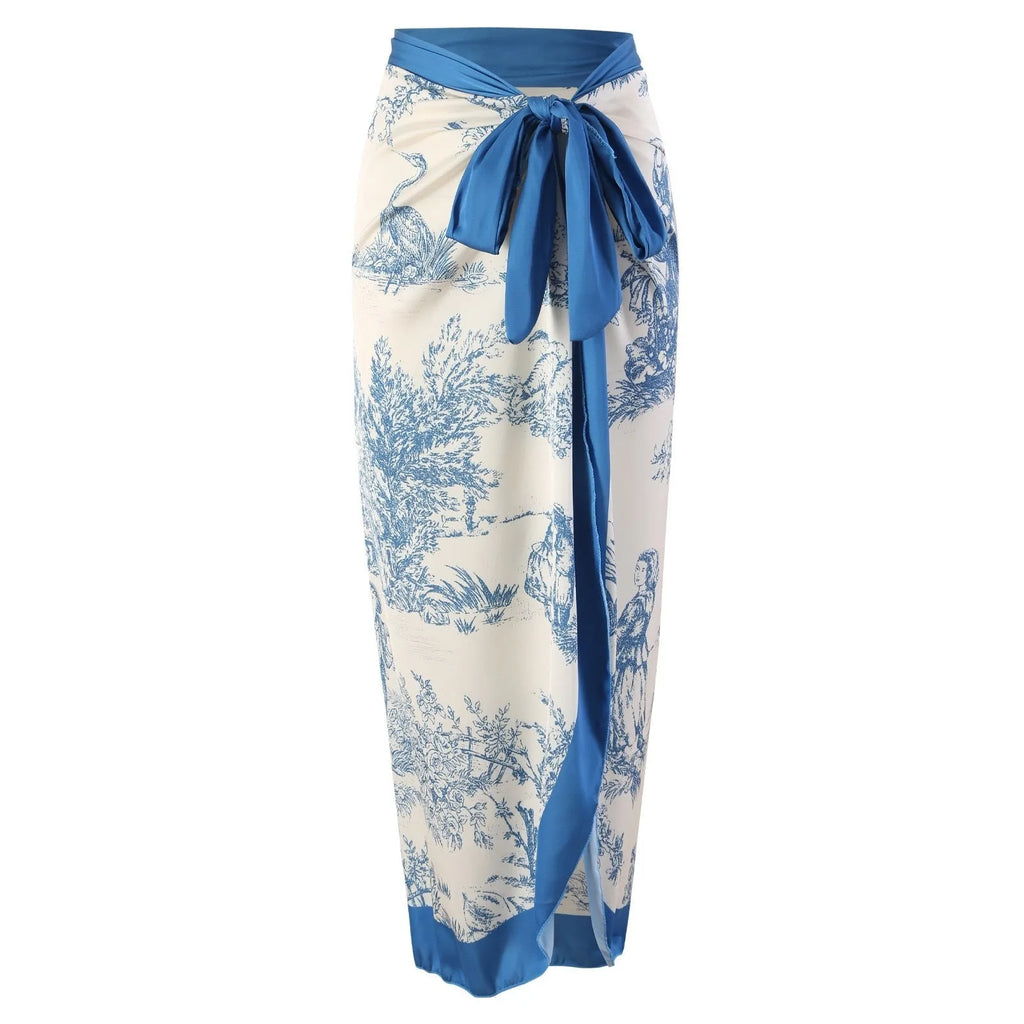 Women's blue patterned one-piece swimsuit with a skirt, made from polyester fabric.