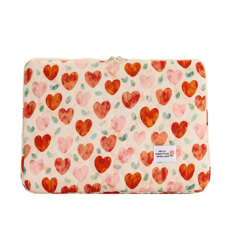 Women's floral print cloth laptop bag showing green flower pattern, available in small, medium, and large sizes.