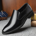 Men's black business casual slip-on shoes with a leather toe cap and sewing line detail.