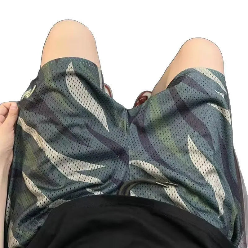 Men's straight-leg camouflage mesh shorts in cotton blend fabric on a white background
