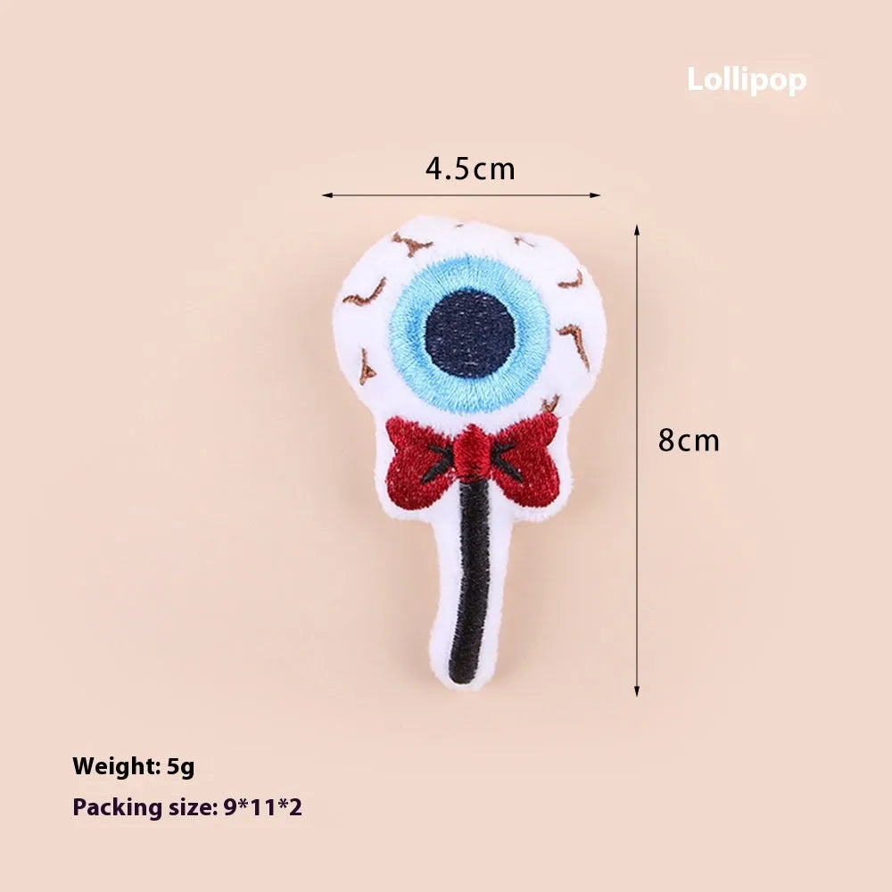 Small cat teaser wand toy with plush candy-themed attachment for interactive pet play
