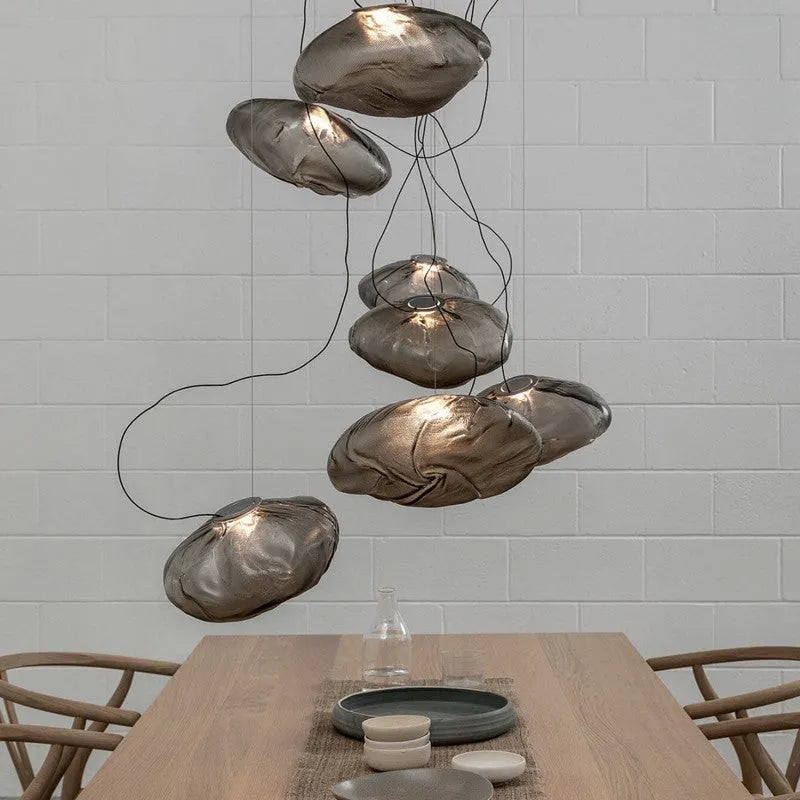Modern glass decorative chandelier light fixture in amber, clear or smoke grey colour.