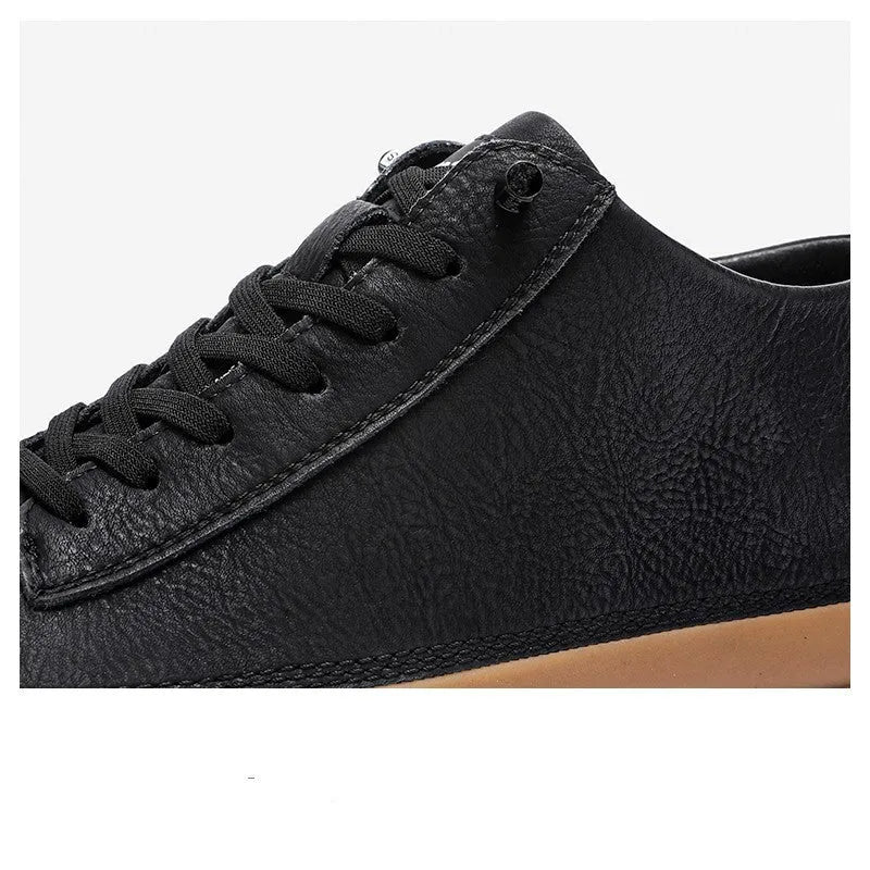 Men's black and white casual leather shoes with round toe, flat heel, and lanyard closure.