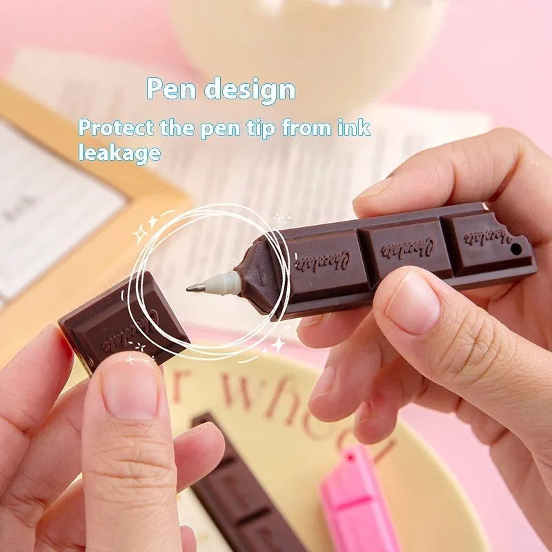 Chocolate ballpoint pen with cartoon simulation food design showing 0.5mm bullet tip and pink, beige, brown refill options.