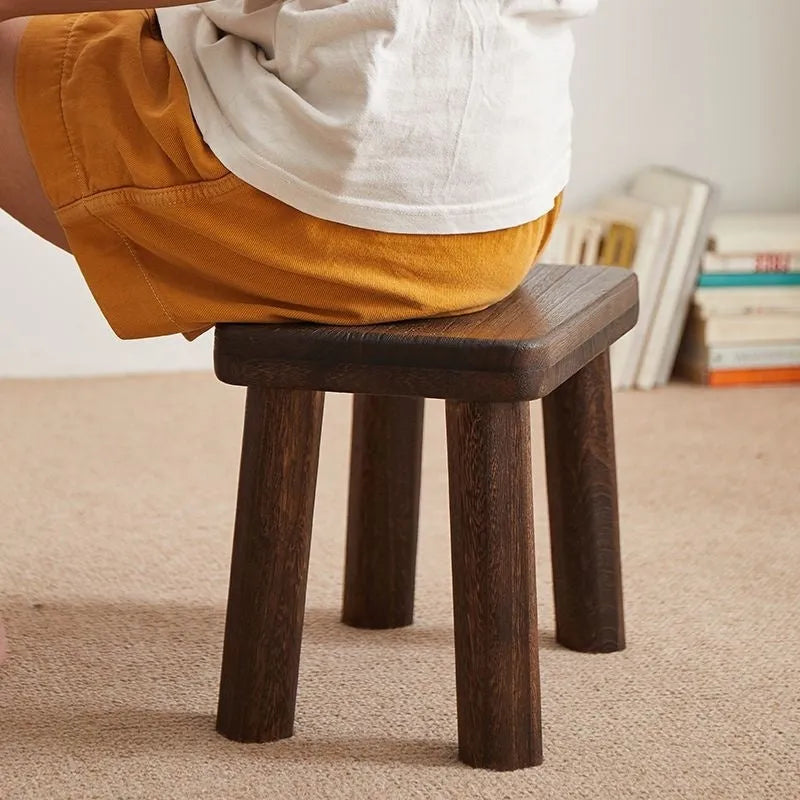 Distressed solid wood shoes changing stool with bracket structure for the living room.