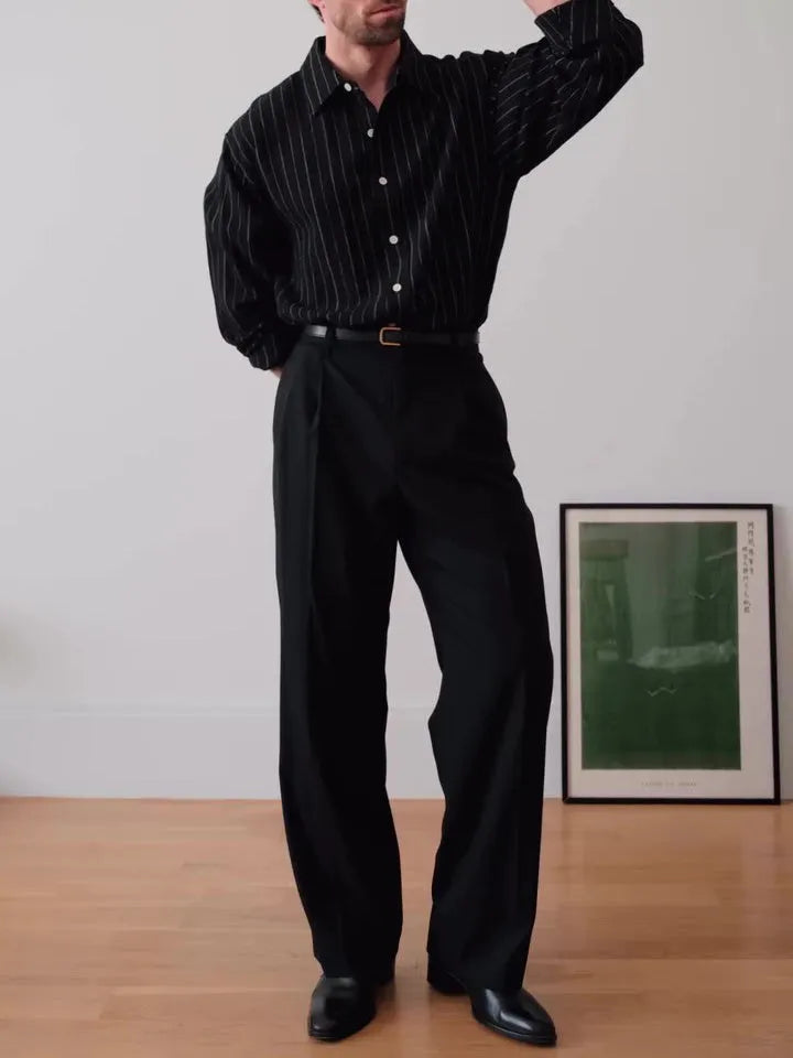 Black pinstriped button-down shirt with regular fit on a hanger