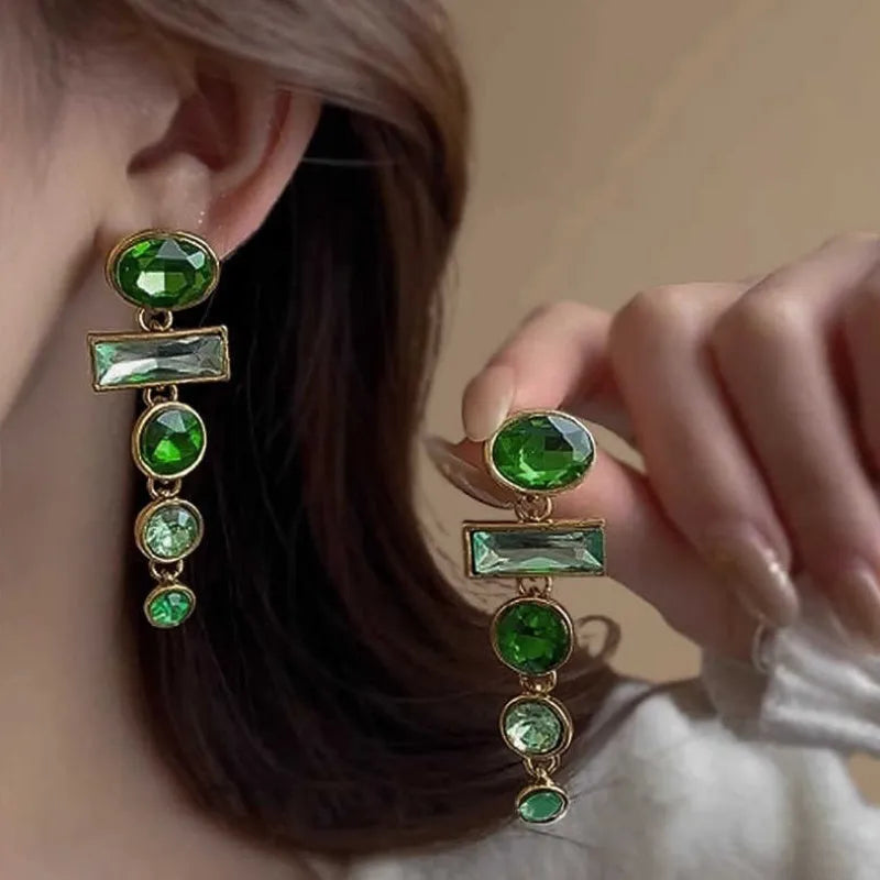A pair of women's green gradient alloy drop earrings with a geometric tassel design and inlaid zircon stone.