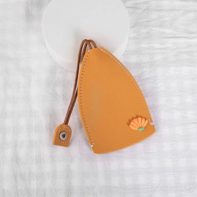 Colourful cartoon pull-out key case made from PU leather, showing the key extended from its protective sleeve.