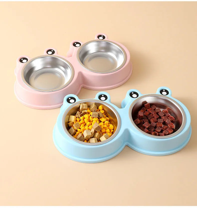 Stainless steel double pet bowl with frog-shaped non-slip base in blue, green, and pink colours
