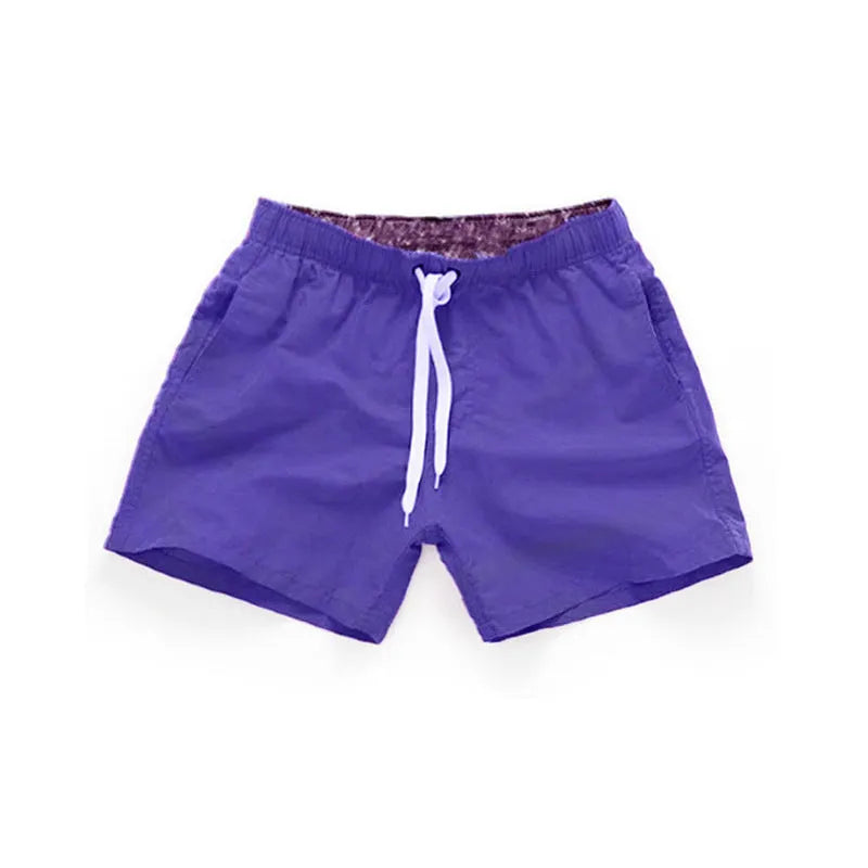 Men's polyester beach shorts in multiple colours with straight leg opening, suitable for surfing and swimming