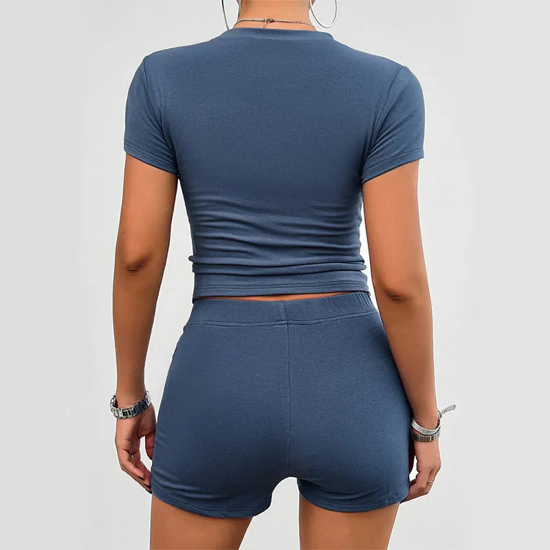 Women's solid colour viscose sports suit set with short sleeve top and elastic shorts on hanger