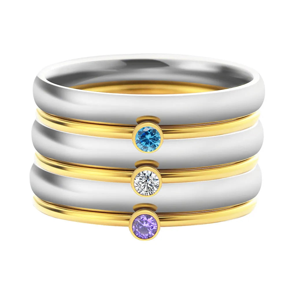 December colour birthstone engraved titanium steel ring with geometric shape on a plain background
