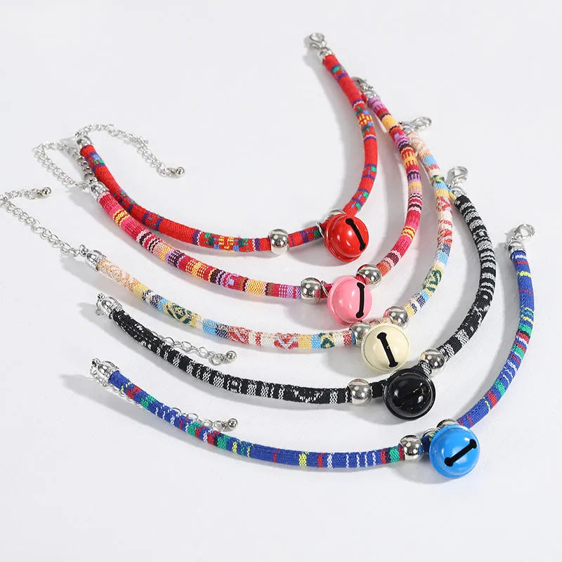 Coloured ethnic pattern adjustable pet collar with a bell for a dog or cat.