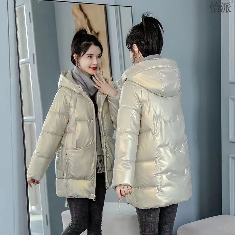 Women's loose thick hooded winter jacket in green, shown with long sleeves and a front zip.