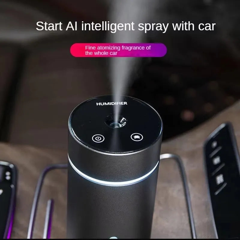 Compact aluminium car humidifier and essential oil diffuser with night light on a desk.