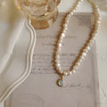 French Court vintage necklace with geometric alloy pendant and pearls on an adjustable 21-50cm chain.