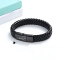 Black leather cord bracelet with woven stainless steel casket pendant.