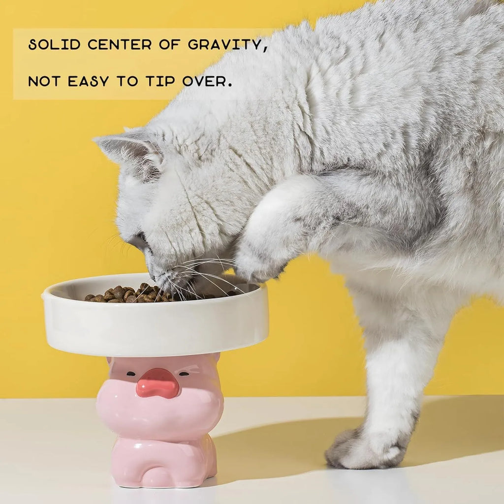 Ceramic raised cat bowl with cute animal design, shown in pink pig, white bear, and yellow duck styles.