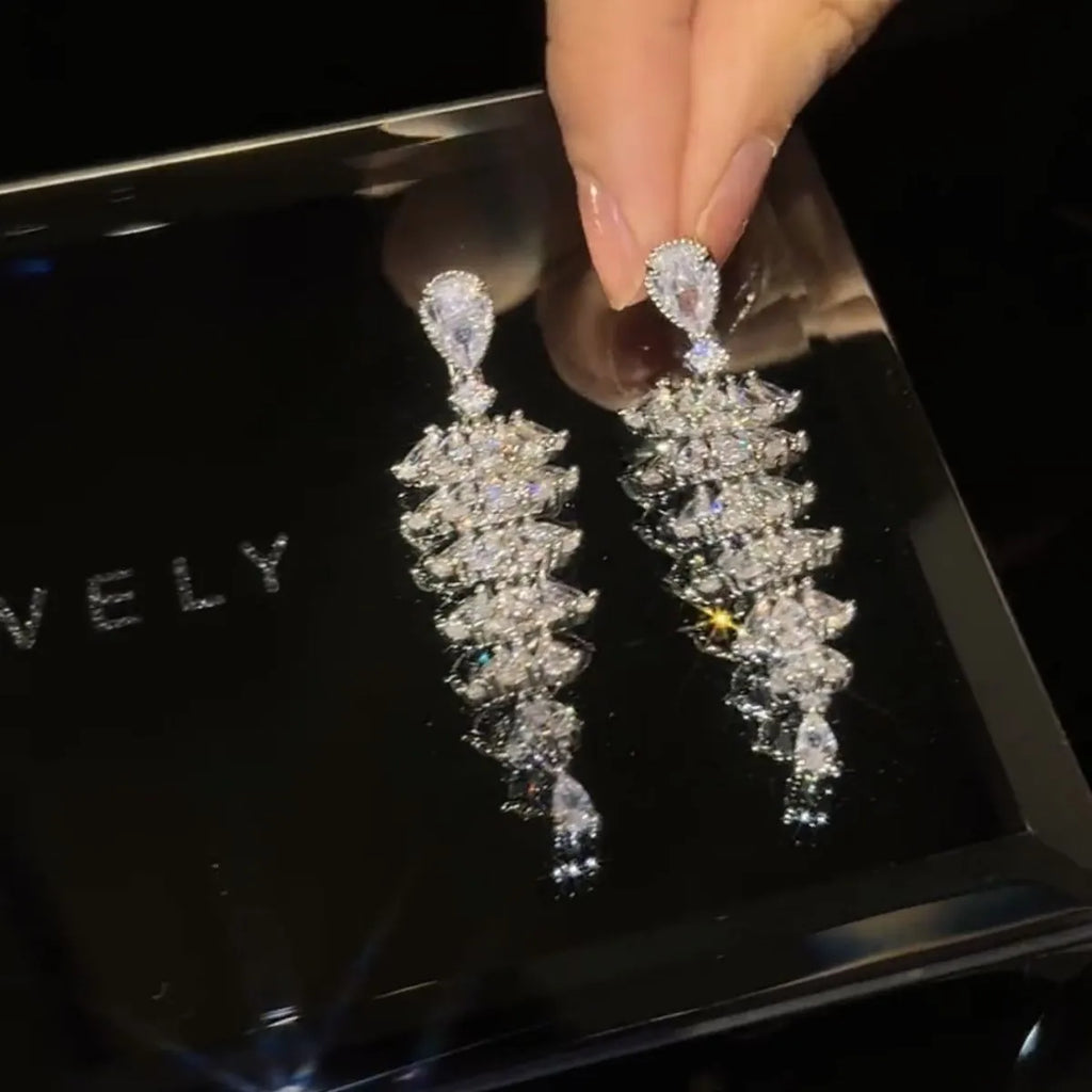Silver pagoda colour zircon Christmas tree shaped drop dangle earrings on a stud fastening.