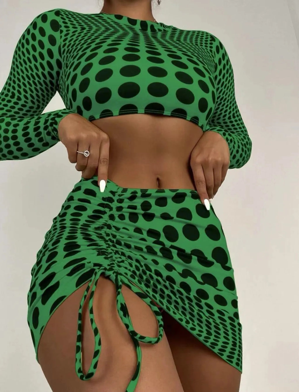 Women's green polka dot three-piece swimsuit set with skirt and padded bikini top