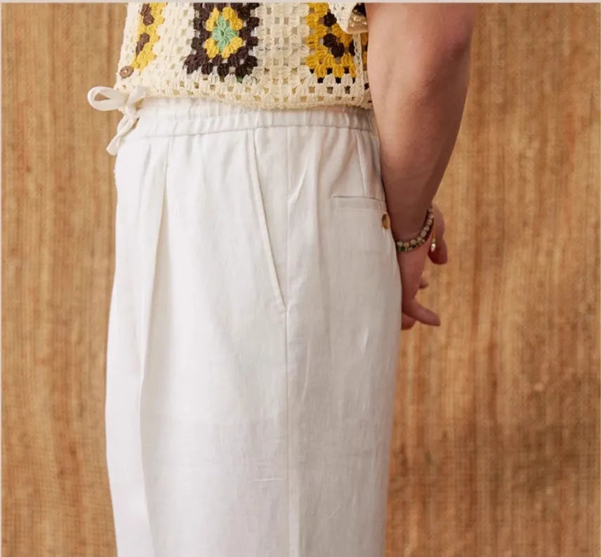 Women's linen casual trousers with elastic high waist and lace trim in navy blue, white, and greige colours