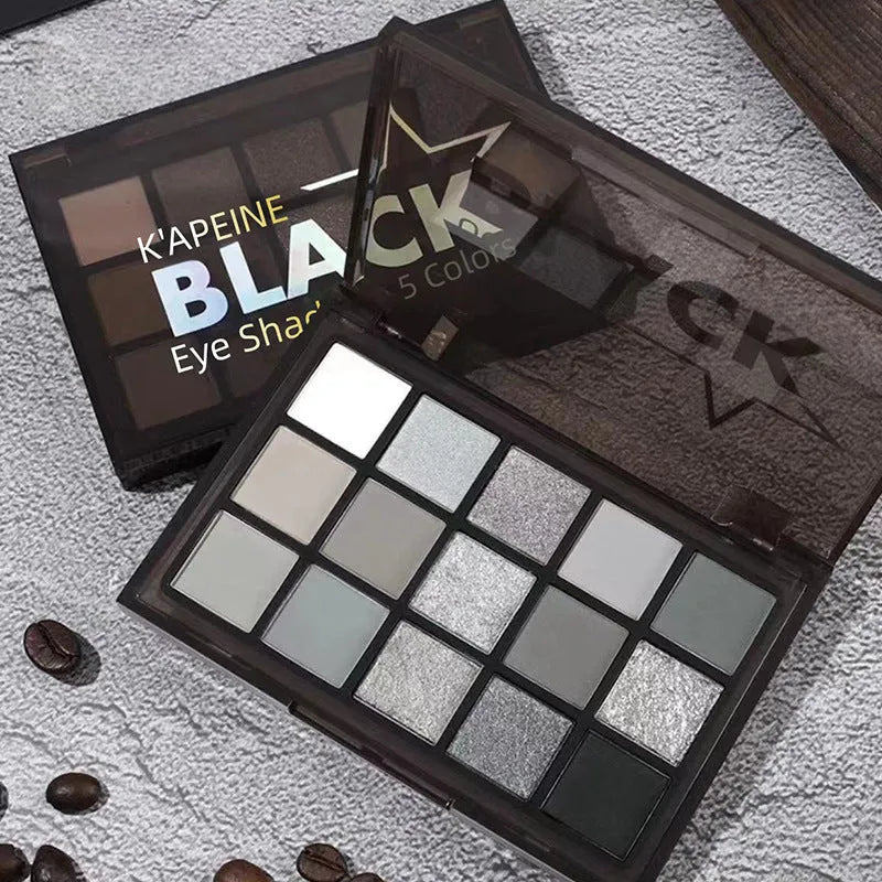 15-colour eyeshadow palette with dark grey, black, and earth tones in matte and shimmer finishes.