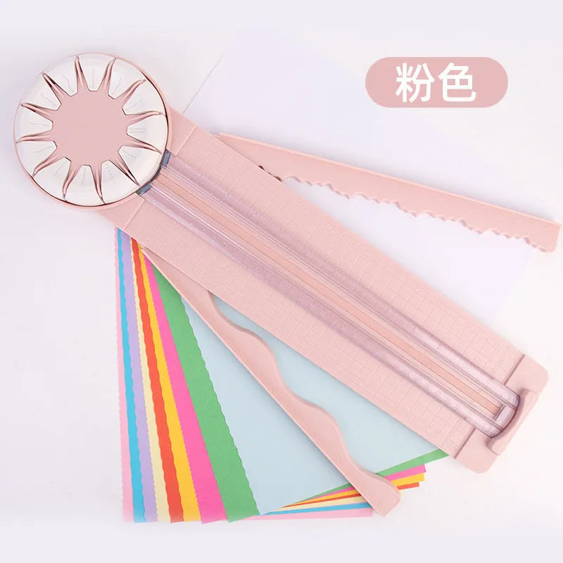 Pink and black plastic paper cutting machine with dotted grid pattern and multiple cutting functions