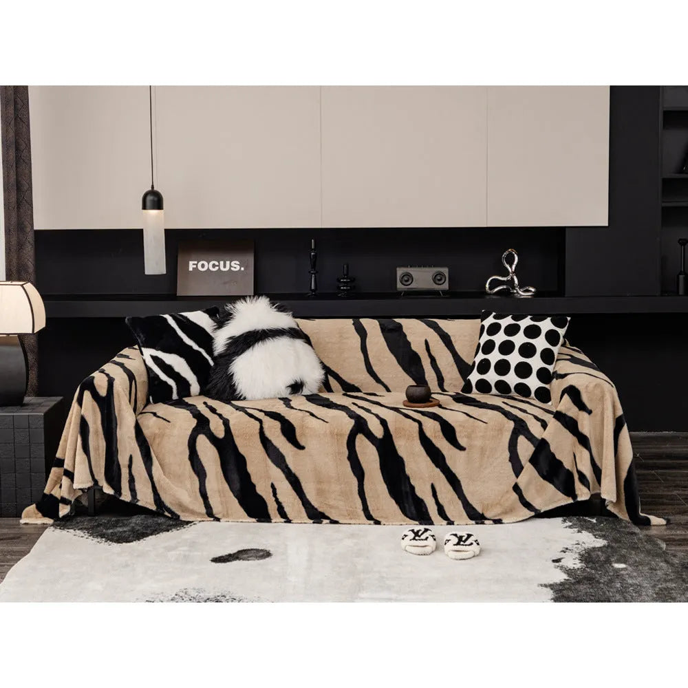 Zebra pattern flannel sofa cover with non-slip properties in caramel colour on a sofa