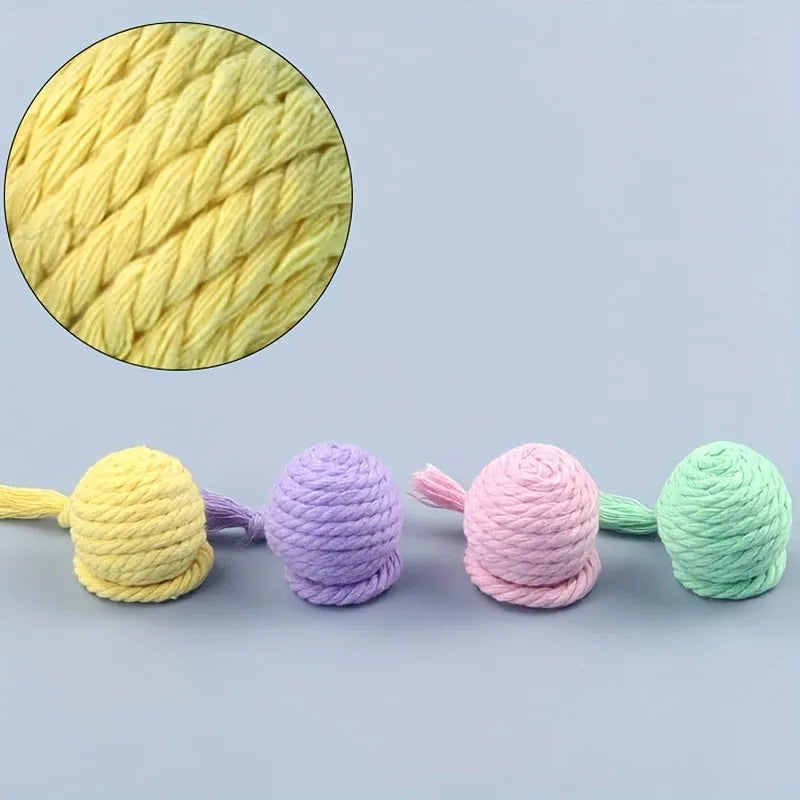 Colourful cat toy ball with rope attachment and built-in bell for interactive play