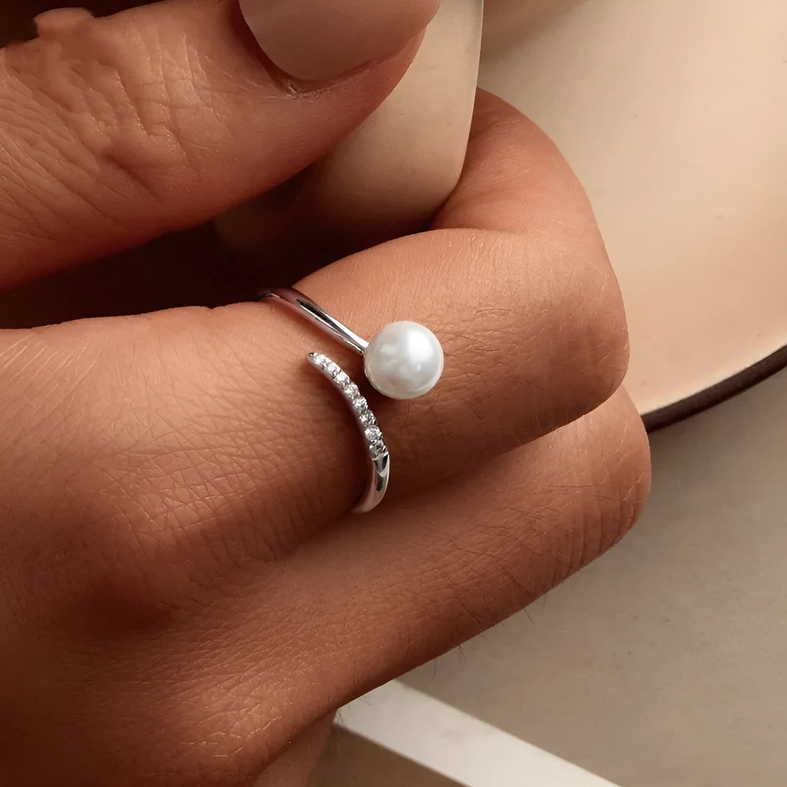 Adjustable open loop sterling silver ring with natural shell pearl in 8 US sizing