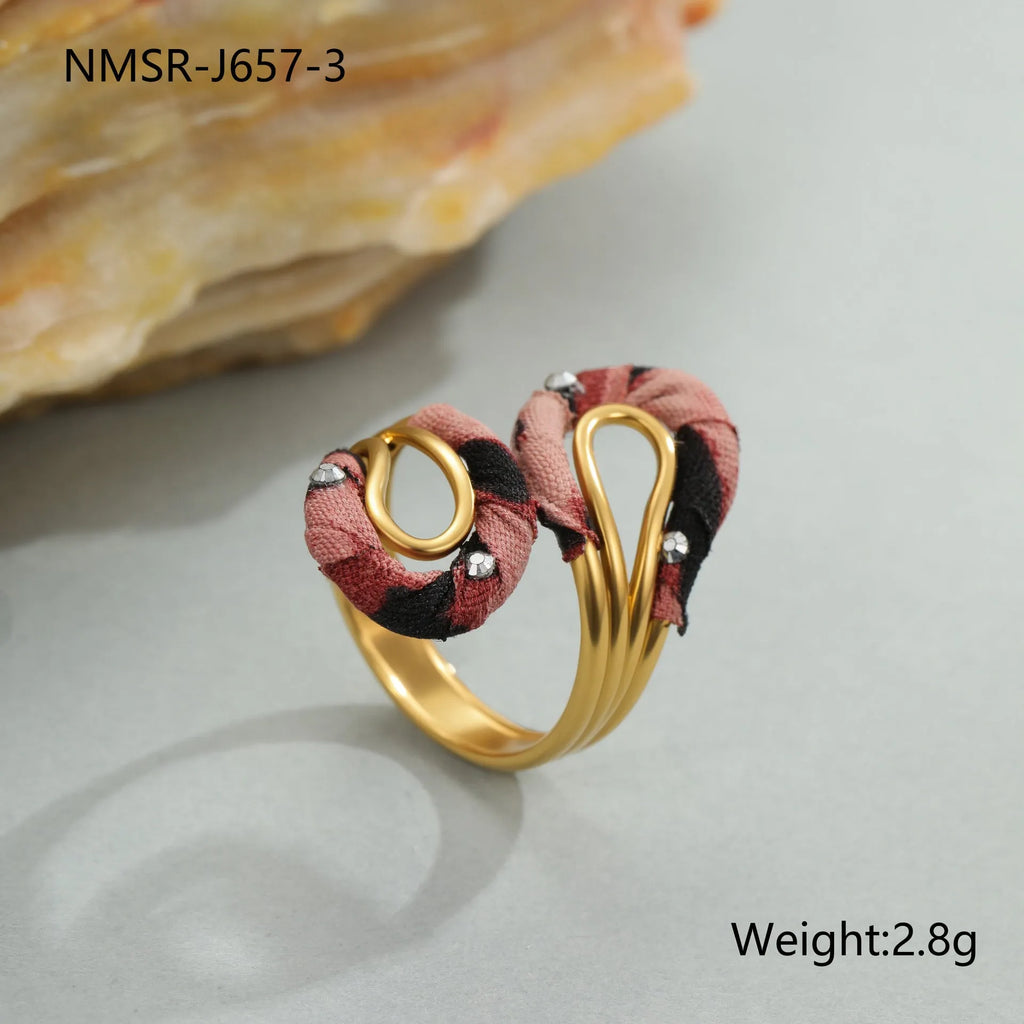 Stainless steel open mouth ring with leopard print and geometric heart or star shape design.