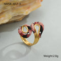 Stainless steel open mouth ring with leopard print and geometric heart or star shape design.