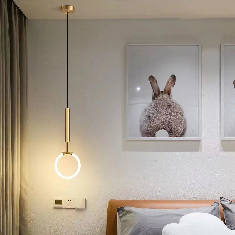 Nordic minimalist U-shaped metal bedside pendant light on a dark background.