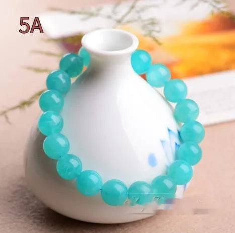 Grade 7A Amazonite natural gemstone scattered beads showing blue-green ice colouration and polished surface
