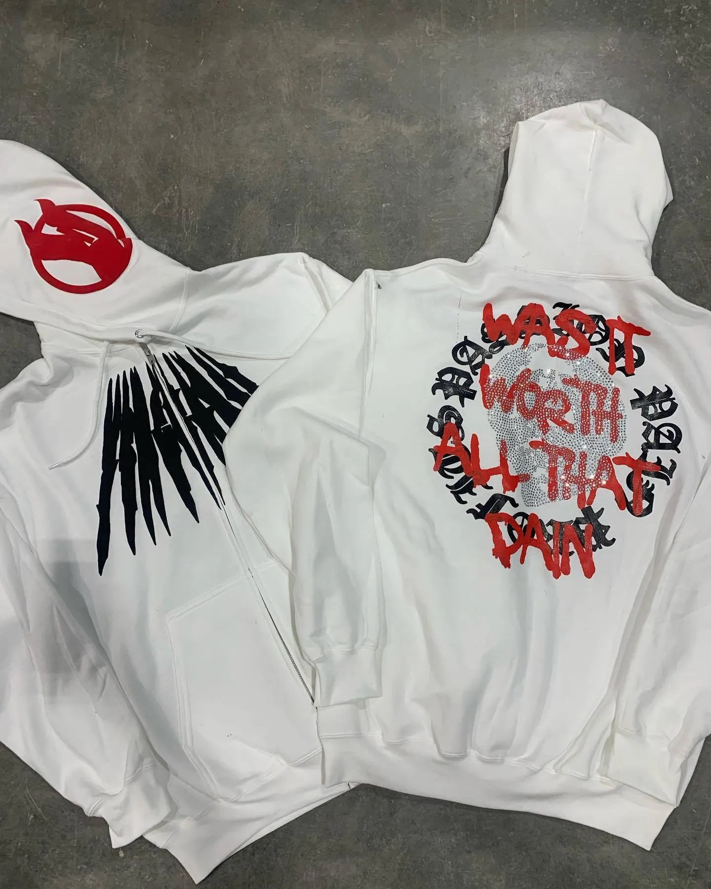 Black hooded sweatshirt with printed skull design and rhinestone decoration in loose cardigan style