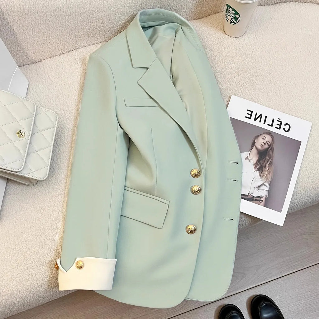 Women's loose-fitting mid-length polyester coat in milky white with pockets.