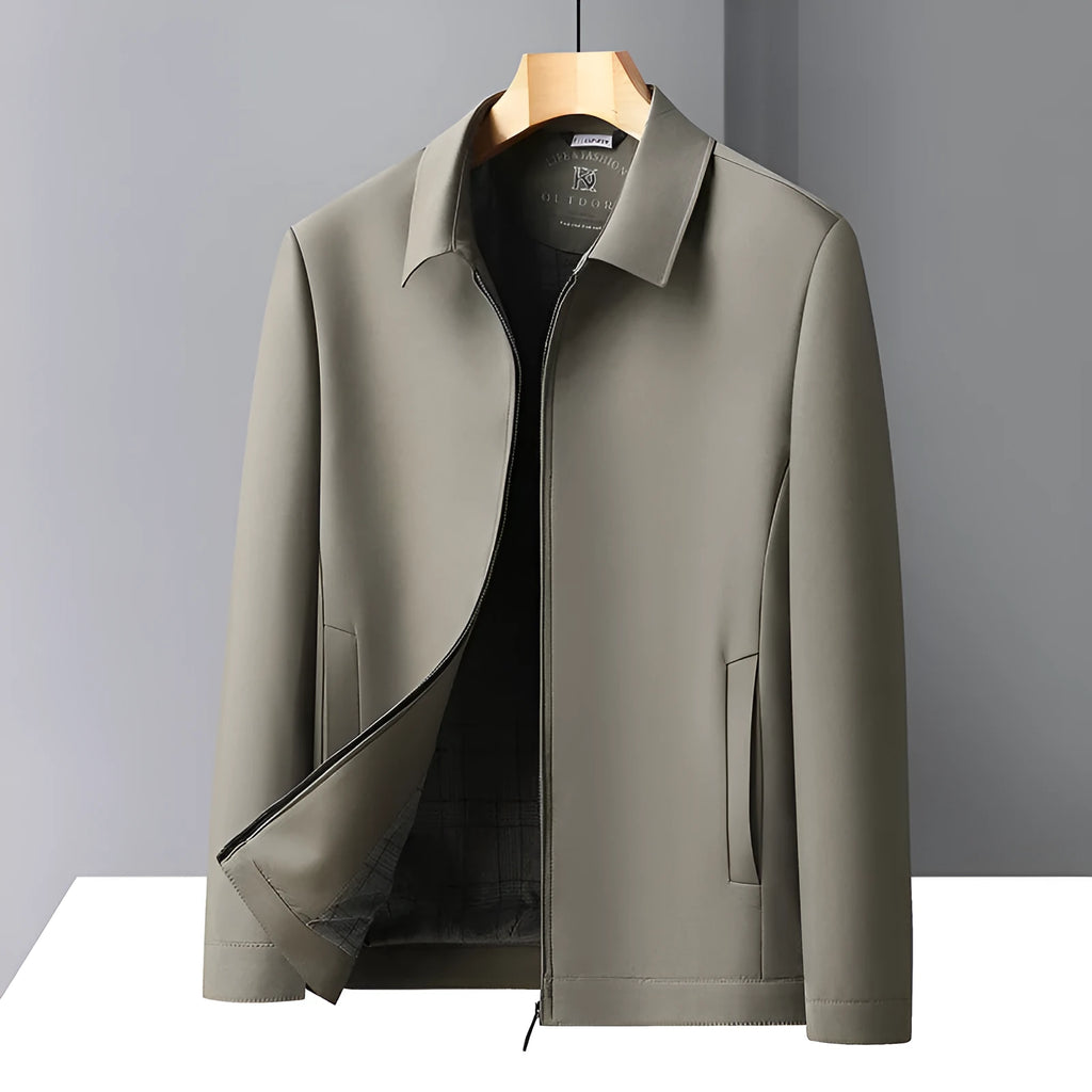 Man wearing a solid khaki loose-fit polo collar casual jacket with side pockets.