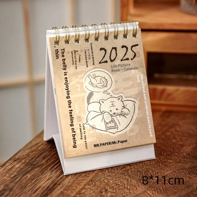 Coffee themed mini desk calendar for 2025 showing four different model designs on a desk.