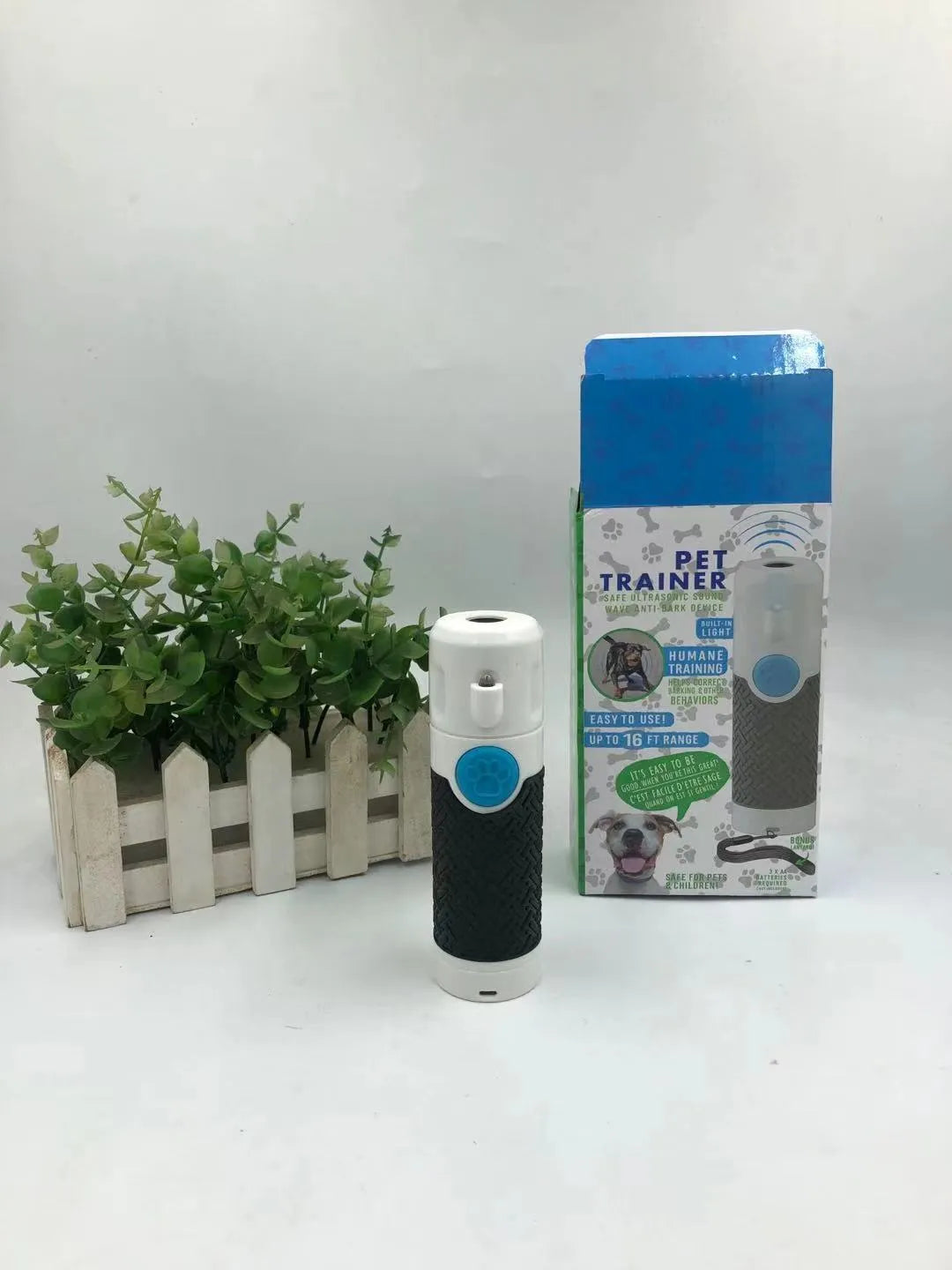 White handheld ultrasonic dog trainer with bark-stop function for behaviour correction training
