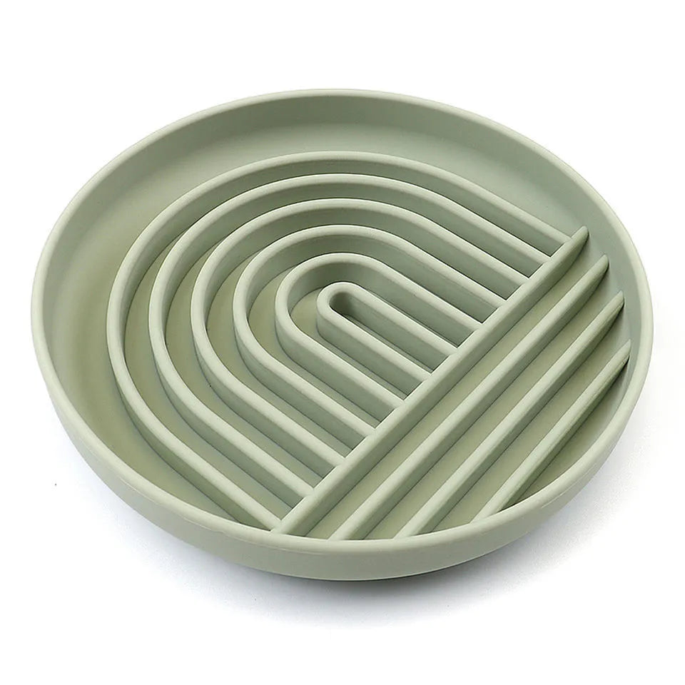 Silicone slow feeder dog bowl with ridges, shown in beige colour, next to dog food.