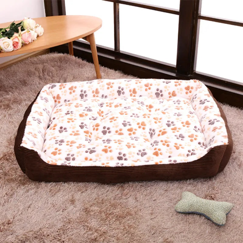 Beige plush dog bed with high bolsters and a removable washable cover for small pets.