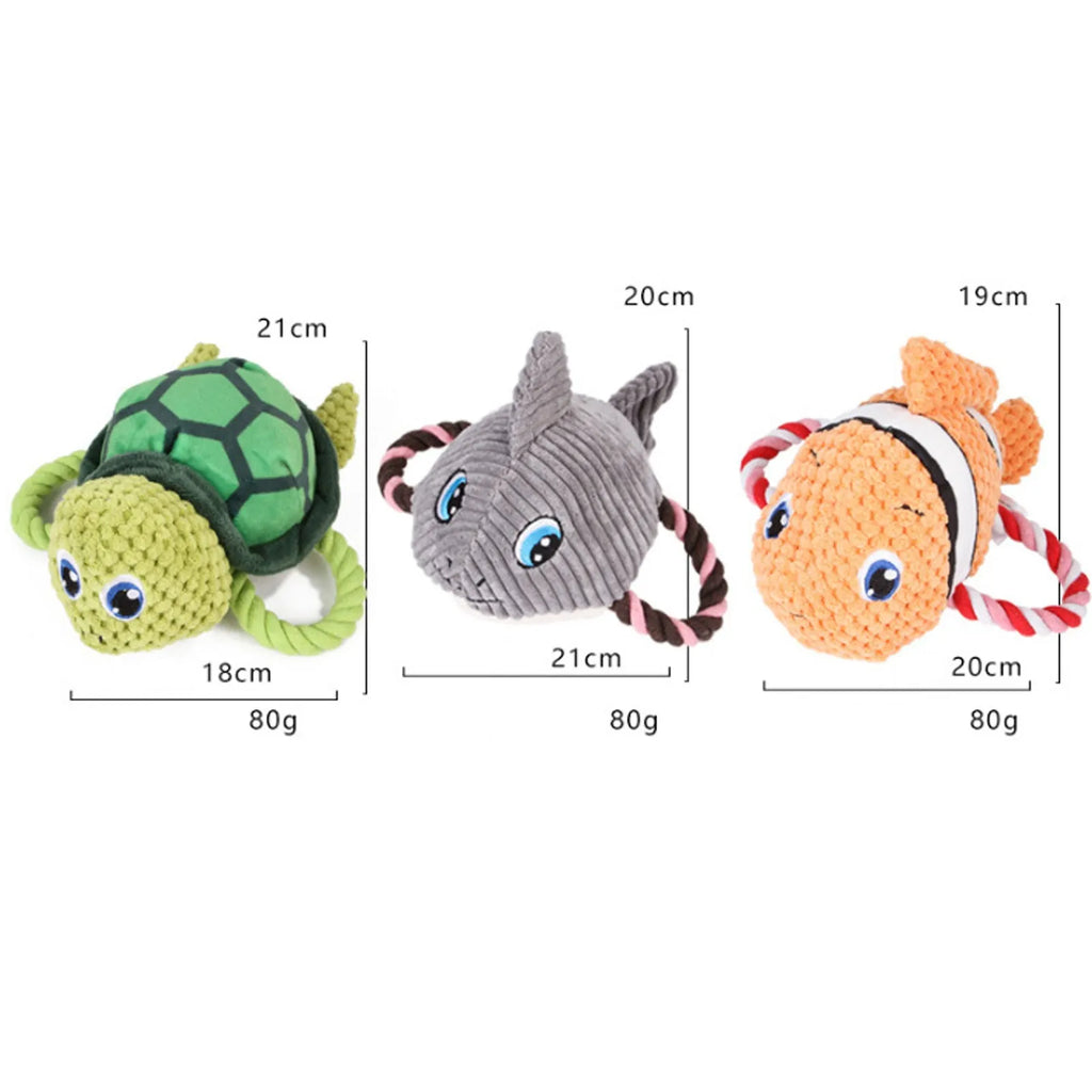 Turtle shaped plush dog toy with knotted rope limbs and squeaker in grey green orange colours
