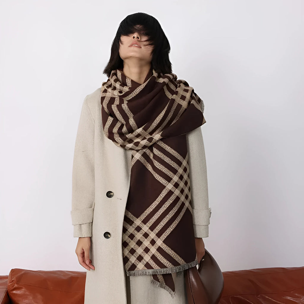 Mid-length brown cashmere-like scarf with tassel ends laid flat.