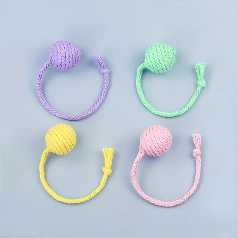 Colourful cat toy ball with rope attachment and built-in bell for interactive play
