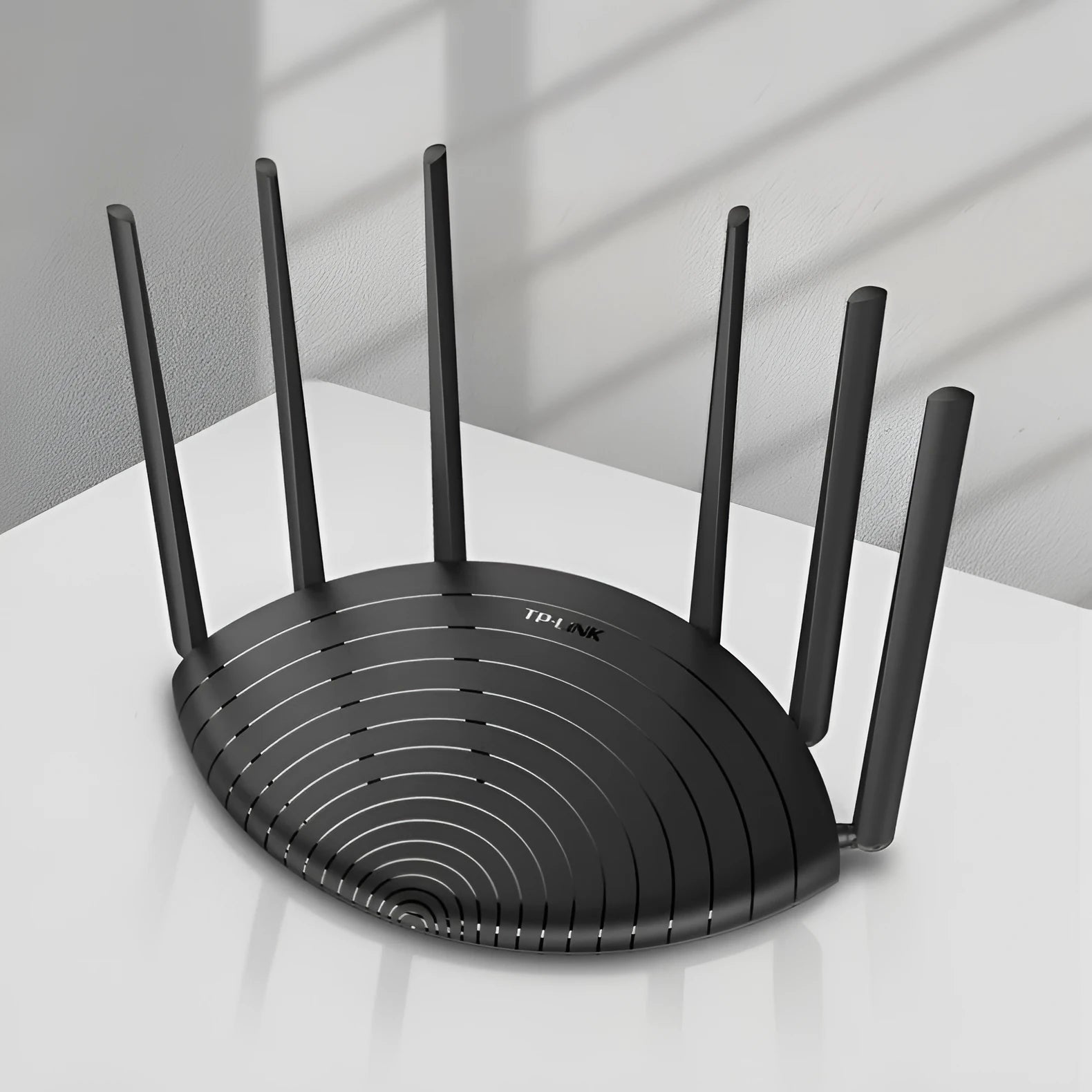 TL-WDR7661 AC1900 Gigabit wireless home router in a compact black casing.