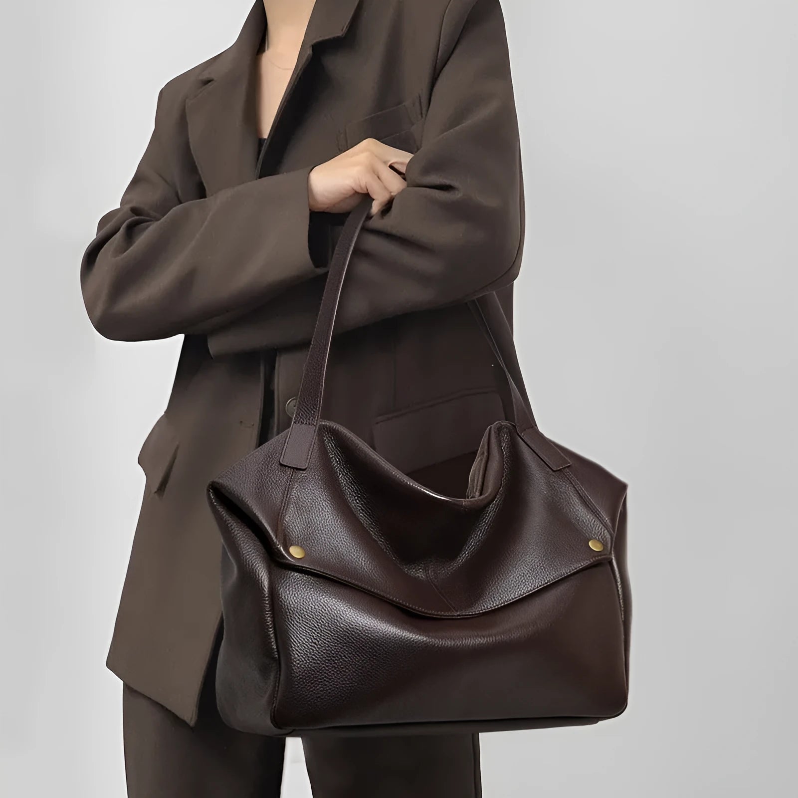 Brown genuine leather women's commuter shoulder bag with horizontal square design and zippered interior compartment