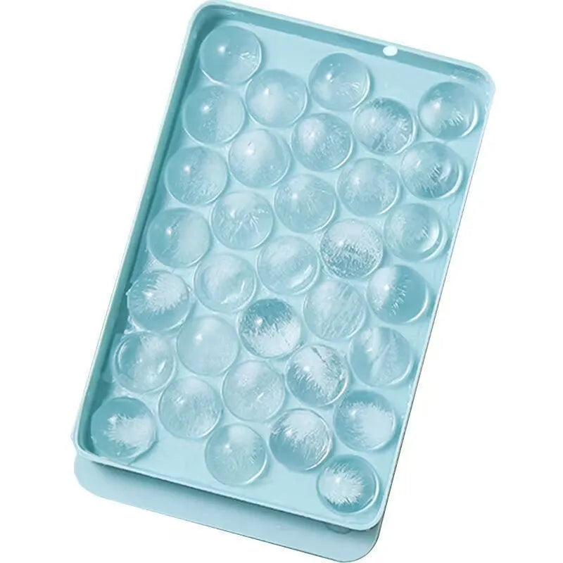 33 grid round silicone ice cube tray with lid in blue or pink measuring 24x14x3cm