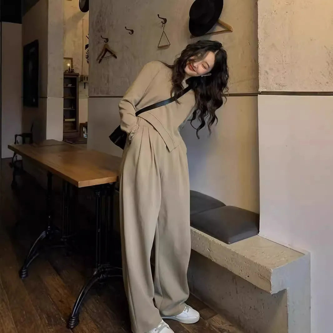 Women's khaki casual sports suit with loose-fit long sleeve top and matching trousers.